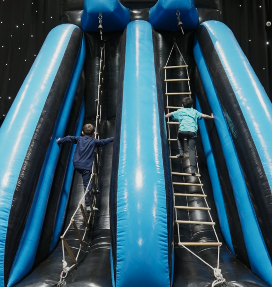 Kids climbing an inflatable 